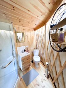 a bathroom with a toilet and a sink and a shower at FORGLAMP in Bydgoszcz +69 photos