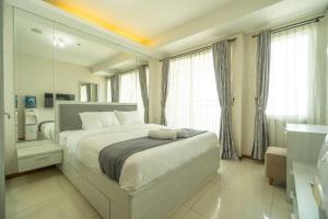 Tempat tidur dalam kamar di simple & stylish studio in central Jakarta, SCBD