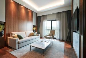TV a/nebo společenská místnost v ubytování The Suites Hotel Jeju