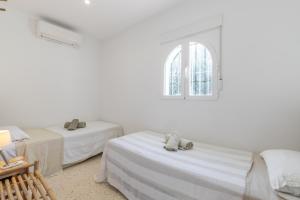 Posteľ alebo postele v izbe v ubytovaní La Sirenita by Sun & Sea Homes
