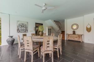 a dining room with a table and chairs at Beautiful Huge 4 bedrooms Villa in Canggu in Canggu