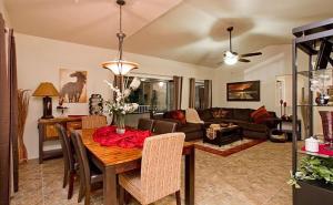 a living room with a table and a couch at Central Location, Heated Pool, Bbq, Hot Tub, More in Scottsdale