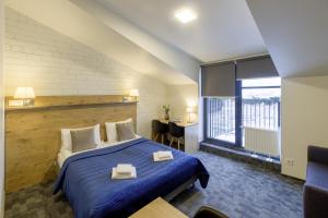 Postel nebo postele na pokoji v ubytování Loft Inn SELF-CHECK IN