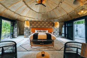 a bedroom in a dome shaped room with a bed at Amarembo by Touch Down in Kigali +51 photos