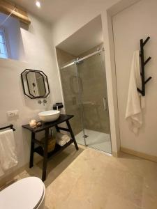 a bathroom with a shower and a sink and a toilet at Croce Luxury Apartment with Air Conditioning, Wi-Fi n0975 in Siracusa +18 photos