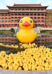 a large rubber duck in front of a building at The Grand Hotel Kaohsiung in Kaohsiung