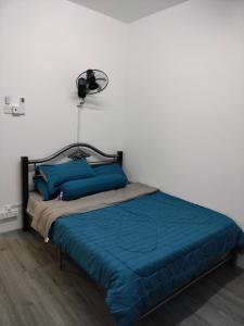 מיטה או מיטות בחדר ב-AZK HOMESTAY
