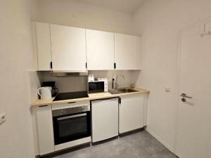 Kuchyň nebo kuchyňský kout v ubytování Nice Apartment in Wuppertal + 9 fotografií