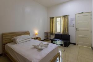 Postel nebo postele na pokoji v ubytování Surf Trip Maldives