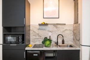 Η κουζίνα ή μικρή κουζίνα στο The New Bliss - Duke Housing