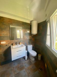 a bathroom with a toilet and a sink at Macaronesia Home in Santa Cruz de Tenerife