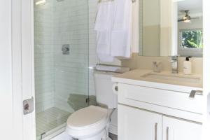 a white bathroom with a toilet and a sink at Redondo Beach 2br walk to shops restaurants LAX-1166 in Torrance +12 photos