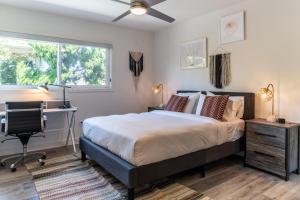 a bedroom with a bed and a desk and a window at Redondo Beach 2br walk to shops restaurants LAX-1166 in Torrance