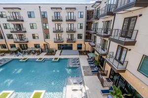 an overhead view of a swimming pool in an apartment building at Highlands 1br w pool wd gym vibrant area ATX-201 in Austin