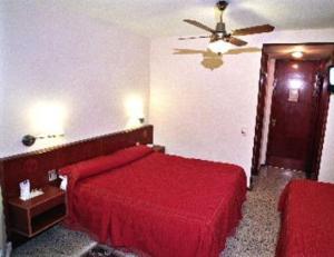 Ένα ή περισσότερα κρεβάτια σε δωμάτιο στο Hotel Chiavari