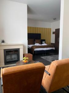 Postel nebo postele na pokoji v ubytování Hotel De Boskar Peer