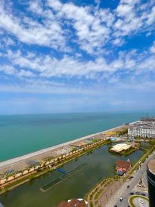 an aerial view of a harbor with the ocean at Orbi City Apartment Sea View in Batumi