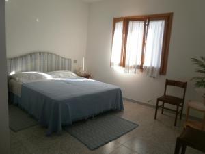Ένα ή περισσότερα κρεβάτια σε δωμάτιο στο Scalas House