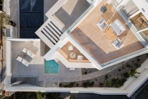 an overhead view of a house with a pool at Athenian Riviera Panorama Villa in Athens