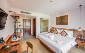 Postel nebo postele na pokoji v ubytování Phnom Penh 51 Hotel & Residences