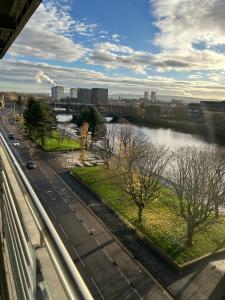 a view of a river from a bridge at Riverview Apartments in Glasgow