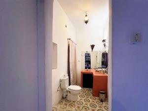 a bathroom with a toilet and a sink at Riad Lazord De Marrakech Entier in Marrakesh