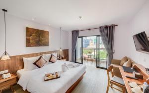 Postel nebo postele na pokoji v ubytování Phnom Penh 51 Hotel & Residences