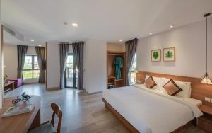 Postel nebo postele na pokoji v ubytování Phnom Penh 51 Hotel & Residences