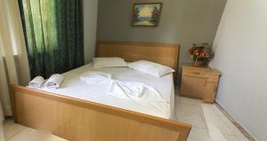 Postel nebo postele na pokoji v ubytování Hotel Central
