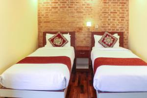 Postel nebo postele na pokoji v ubytování Budhanilkantha Sacred Trails Kathmandu Homestay