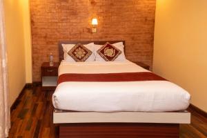 Postel nebo postele na pokoji v ubytování Budhanilkantha Sacred Trails Kathmandu Homestay