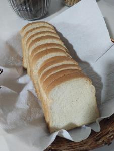 a loaf of bread sitting on a piece of paper at MAGA PLAZA HOTEL in São José do Rio Pardo