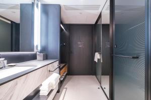 Ένα μπάνιο στο 杭州西溪黄龙时代城际酒店 Intercity Hotel