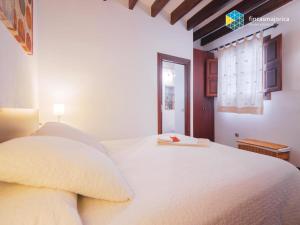 Giường trong phòng chung tại Apartamento Porta del Mar