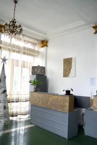 a lobby with a reception desk and a christmas tree at 21 На удачу in Rustavi
