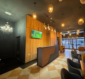 TV a/nebo společenská místnost v ubytování Hotel Fama