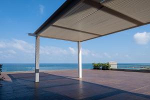 a pavilion with a view of the ocean at The Vista At Hilton Tel Aviv in Tel Aviv