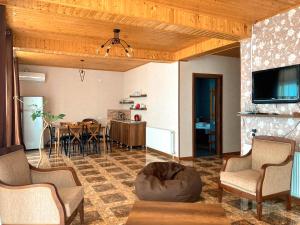 a living room with a couch and a table at Hotel VIM in Sighnaghi in Sighnaghi