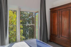 Postel nebo postele na pokoji v ubytování Villa Eugenia Suite - by MyHomeInComo
