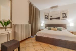 En eller flere senge i et værelse på The Patio over Varenna + 54 billeder