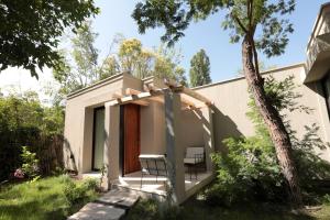 Um jardim em Heura Petit Hotel