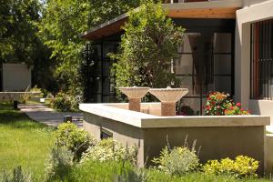 Um jardim em Heura Petit Hotel