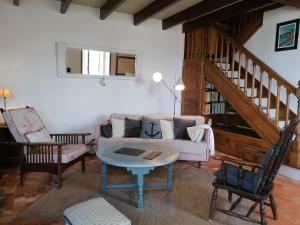 a living room with a couch and a table at Maison de pêcheur Loguivy de la mer pour 7pp in Ploubazlanec