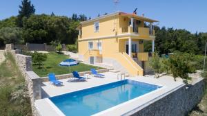 a villa with a swimming pool and a house at Villa Marafen by CorfuEscapes in Lefkimmi