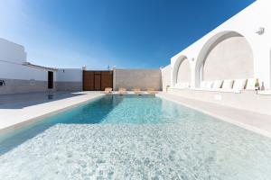 a swimming pool in the middle of a building at MalagaSuite Villa Nomada El Torcal in Antequera