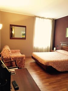 Postel nebo postele na pokoji v ubytování Albergo San Lorenzo + 37 fotografií