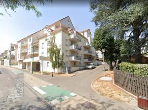 an apartment building on the side of a street at L'Estival - Free parking in Mainvilliers