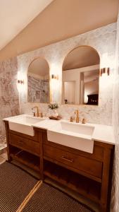 a bathroom with a large sink and a mirror at Fragrant Finnish Sauna & Cozy Pool with French 3br in Las Vegas