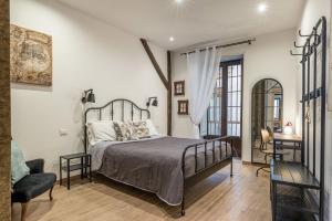Säng eller sängar i ett rum på Borsa Apartments by Wonderful Italy