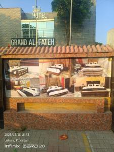 a display window of a hotel with a bunch of beds at Grand AlFateh Hotel in Lahore